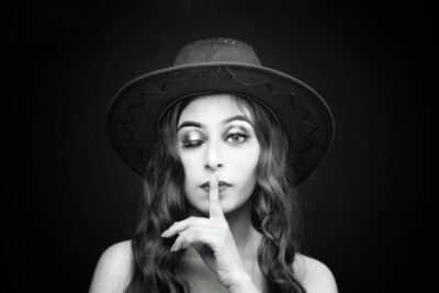 woman wearing hat grayscale photo