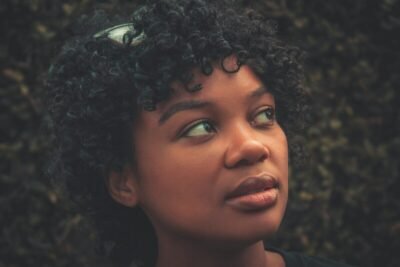 a close up of a person with curly hair